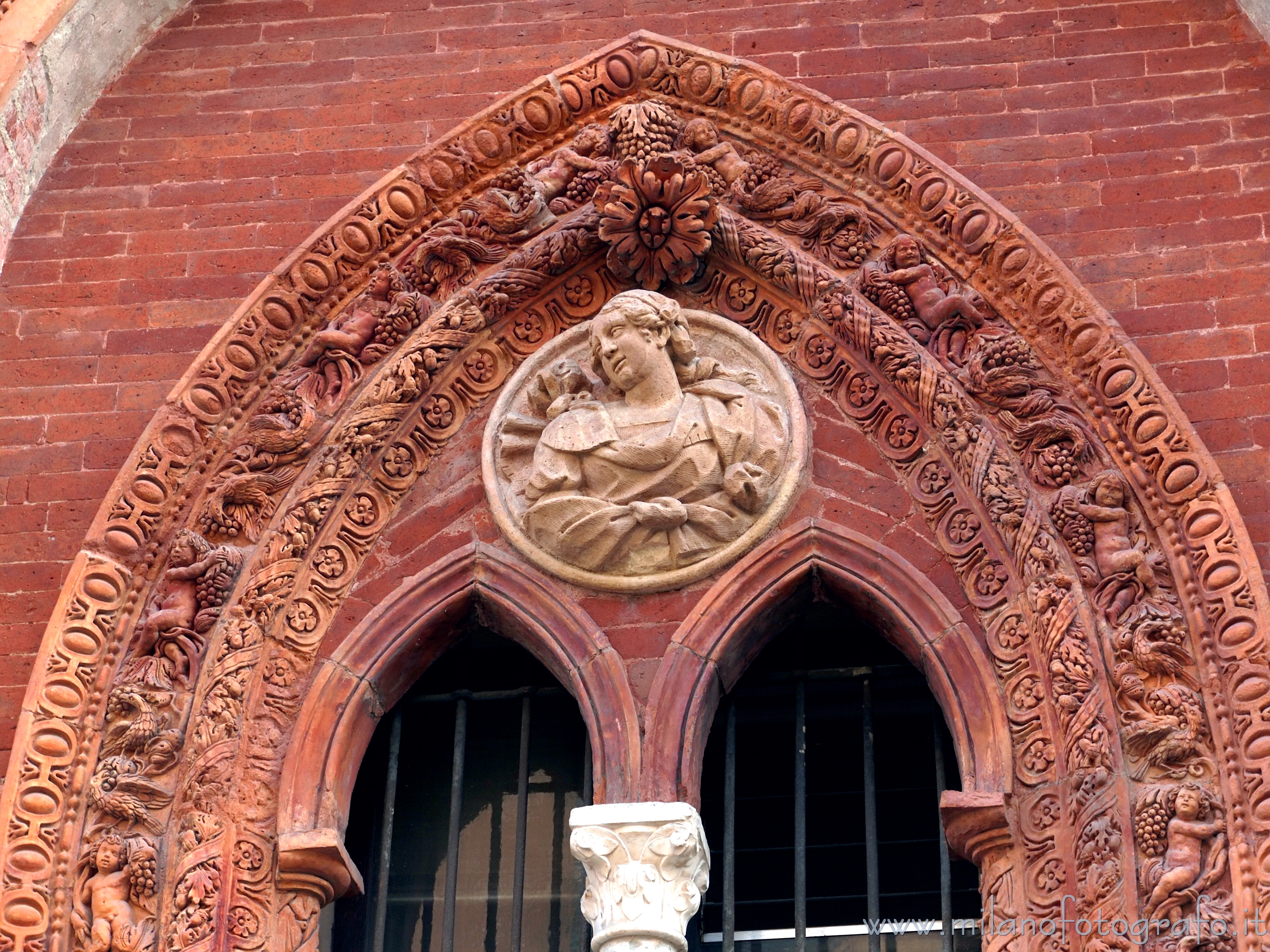 Milan (Italy) - Detail of a mirror in the facade of the once Ca'Granda hospital